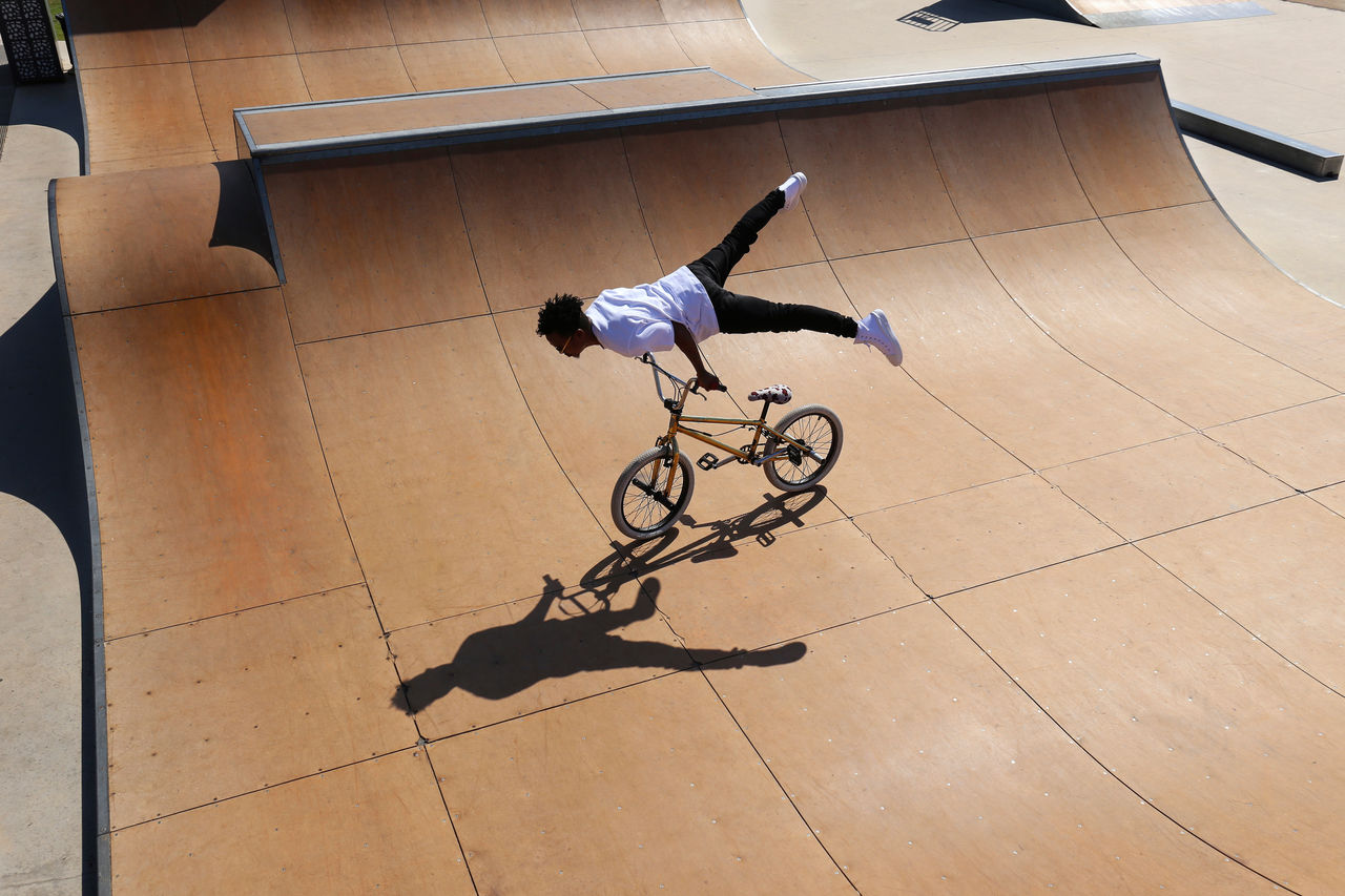 Man practicing stunts on bmx bike at skatepark; Shutterstock ID 2269388971; purchase_order: Masterbrand - Loop 4; job: ; client: ; other: 