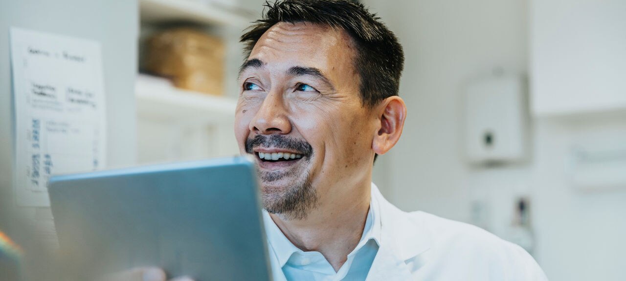 Scientist with a digital tablet in laboratory, NRW, Germany