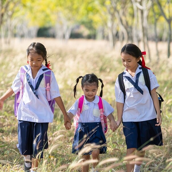 Three sisters going together to school