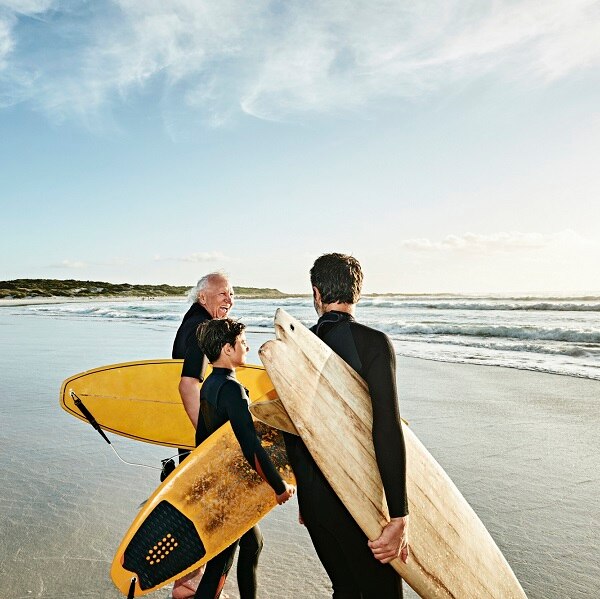 Three male generation surfing together