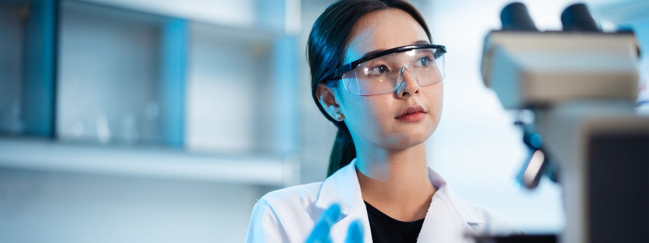 Young Asian scientist working in the Laboratory