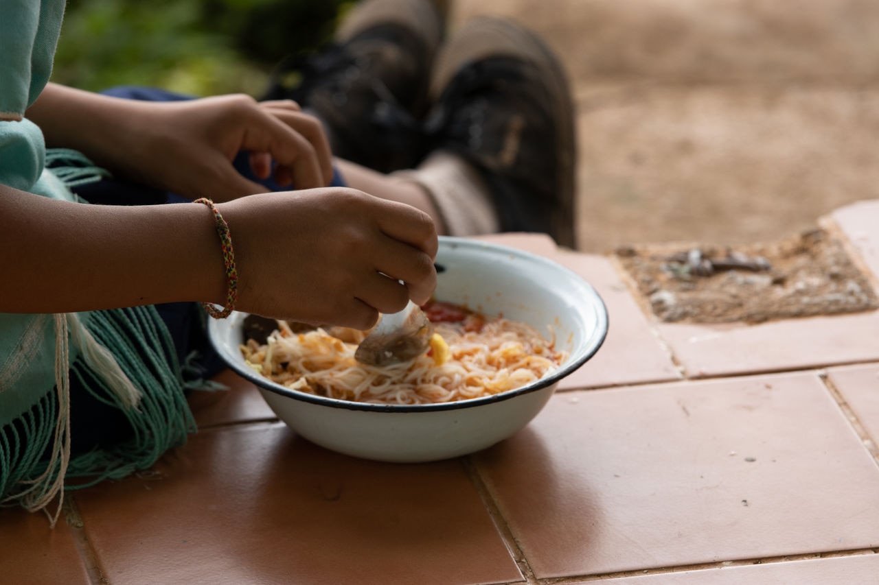Feeding the poor to hands of a beggar. Poverty concept.