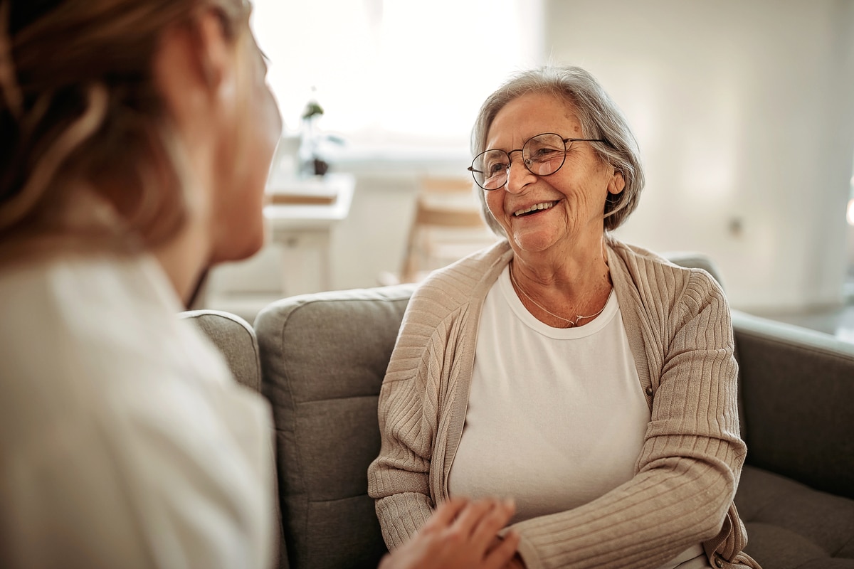 Female doctor consulting her senior patient