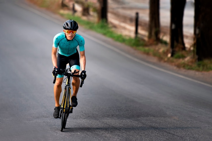 Cyclist riding a bicycle in  bike lane