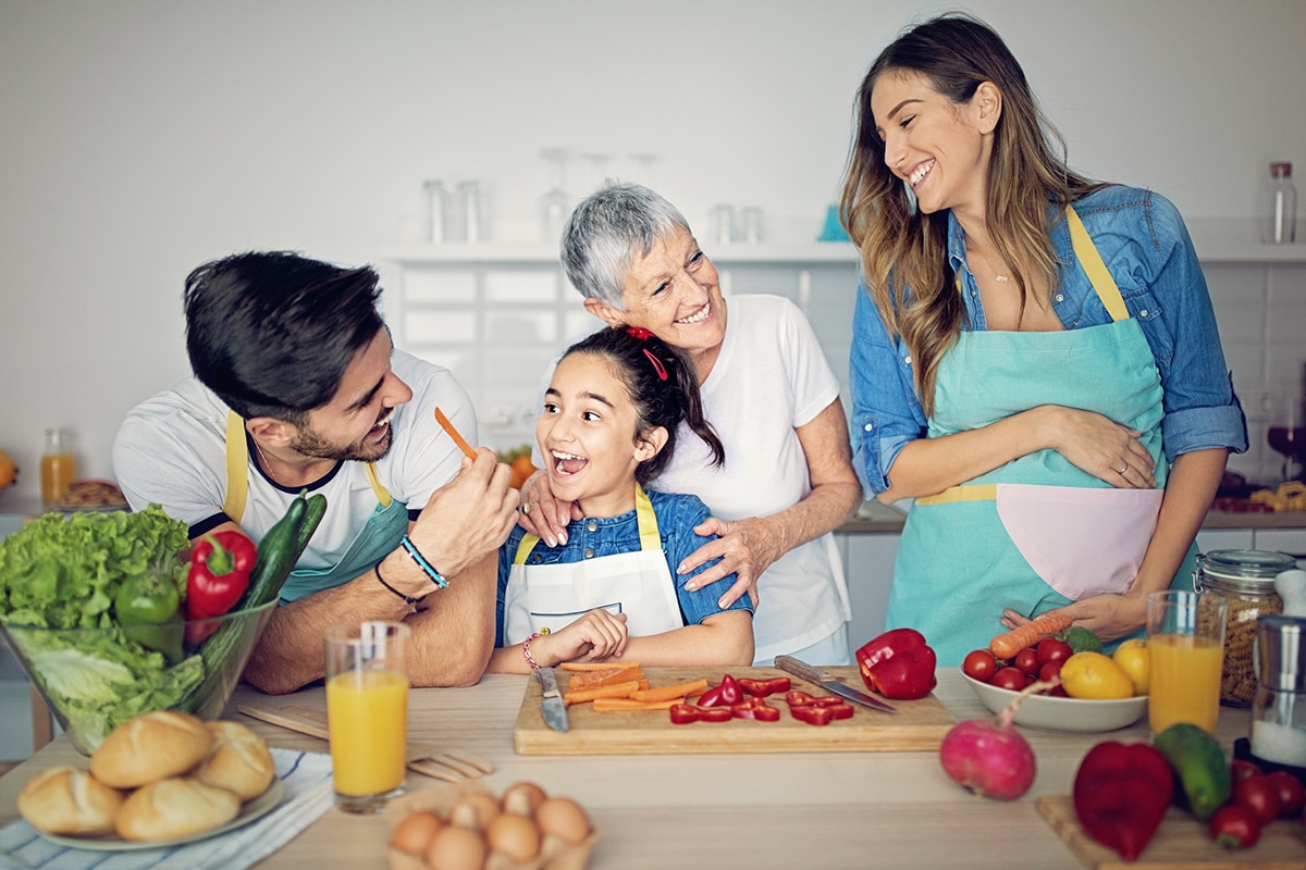 Happy family is cooking together in kitchen