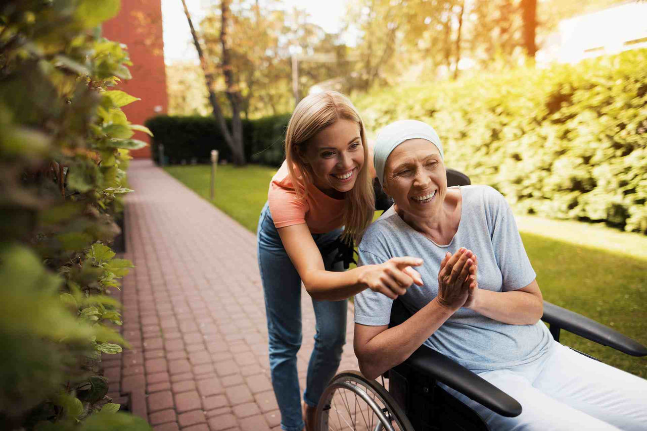 Daughter supporting her mother with cancer
