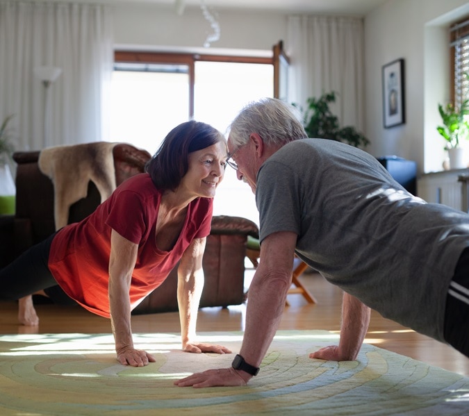 Senior couple staying home and staying fit during COVID-19 lockdown