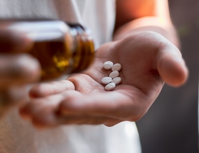 Woman taking some pills