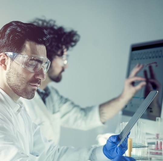 Male scientist working with a tablet
