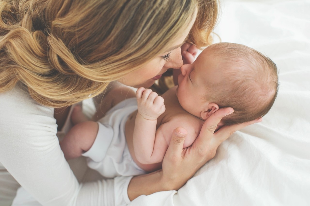 Woman close to her born baby