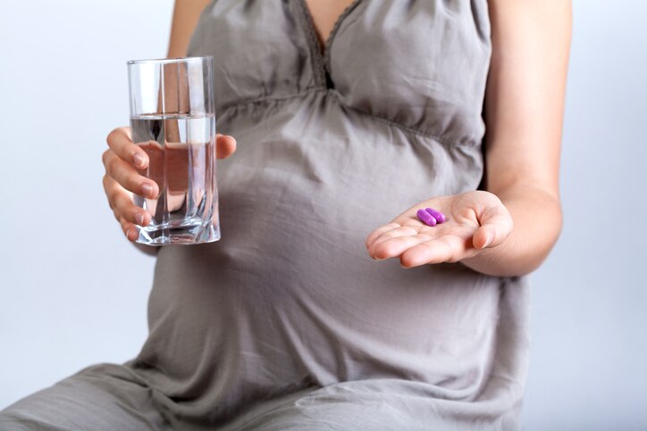 Woman taking pills