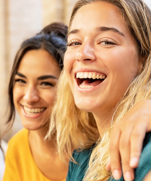 2 women smiling