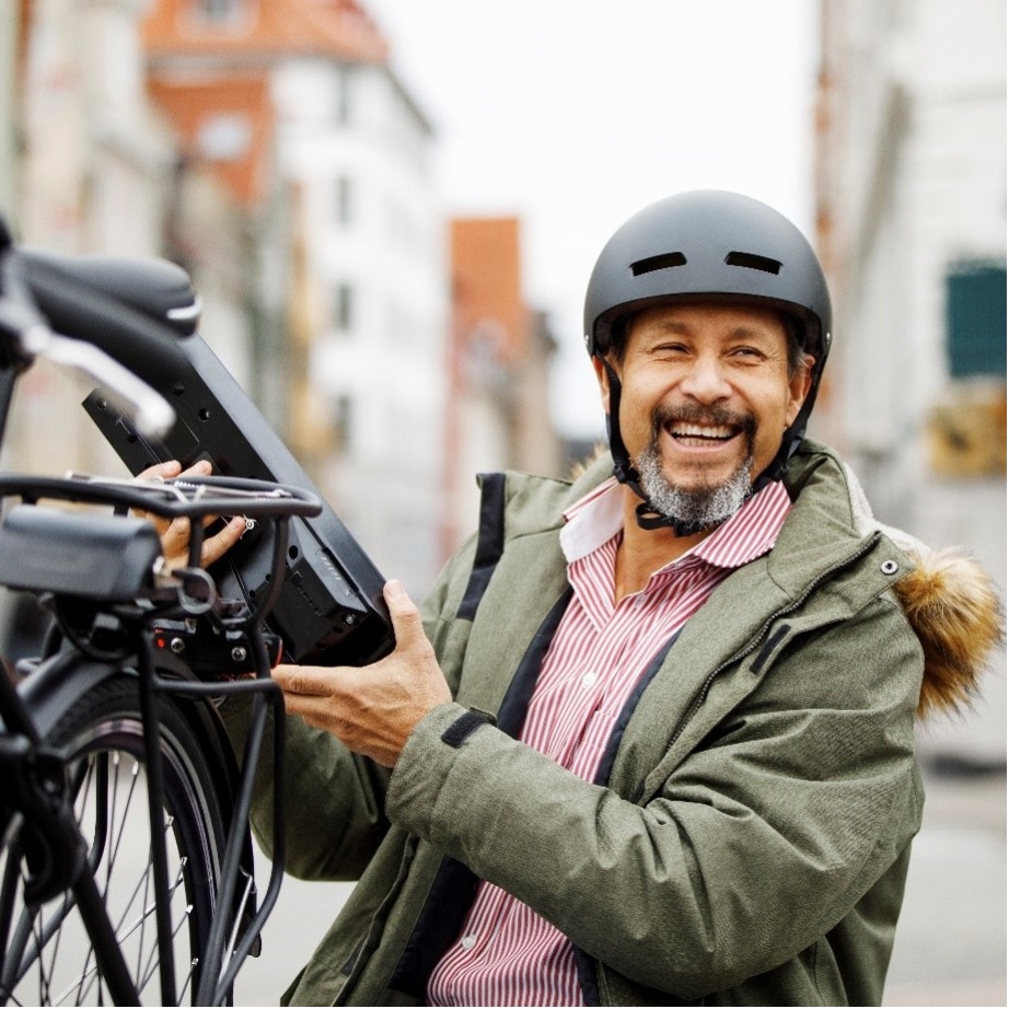 man holding byecycle