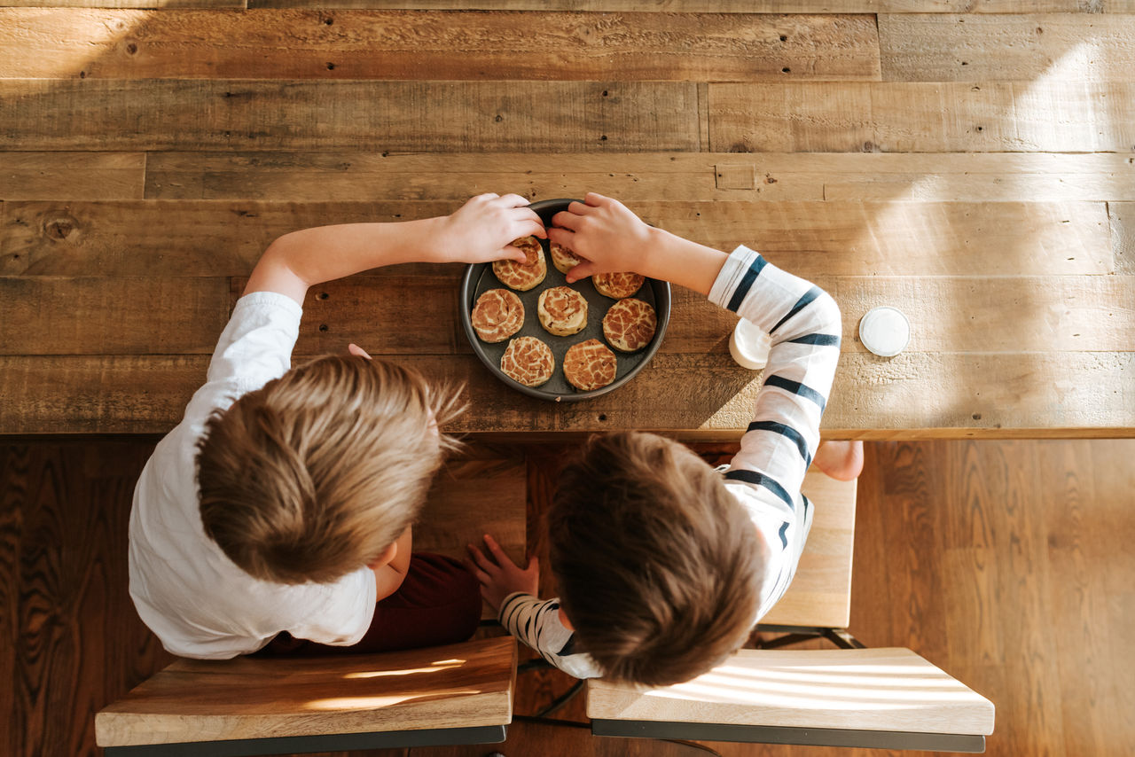 Overhead view of boys making cinnamon rolls