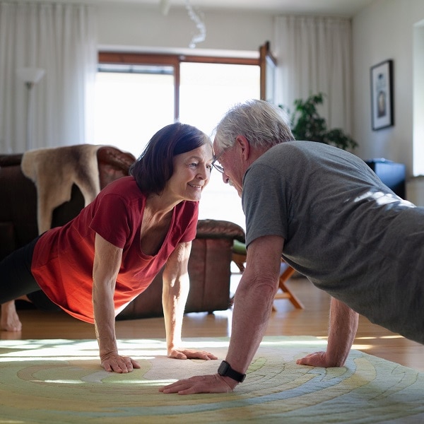 Senior couple staying home and staying fit during COVID-19 lockdown