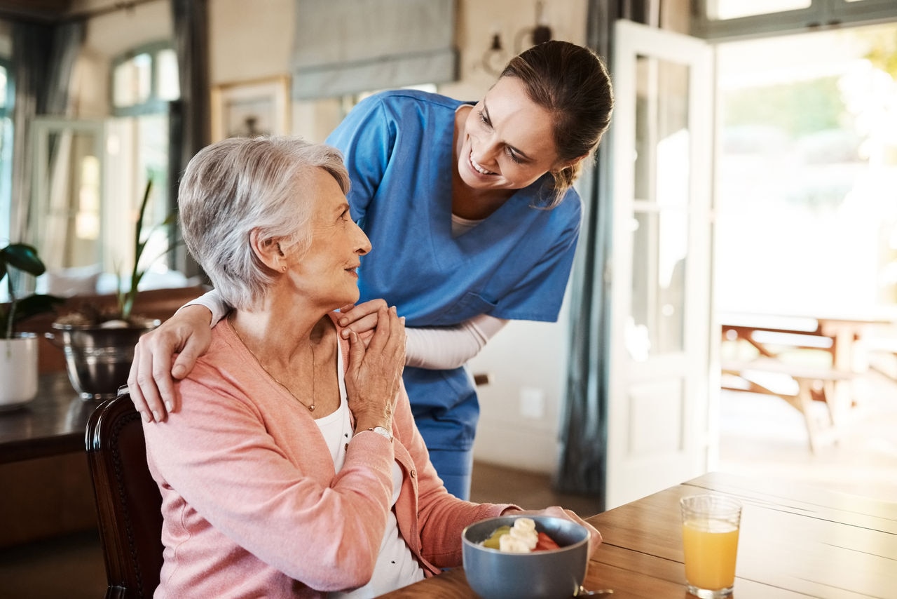 Young nurse checking up on a senior woman 