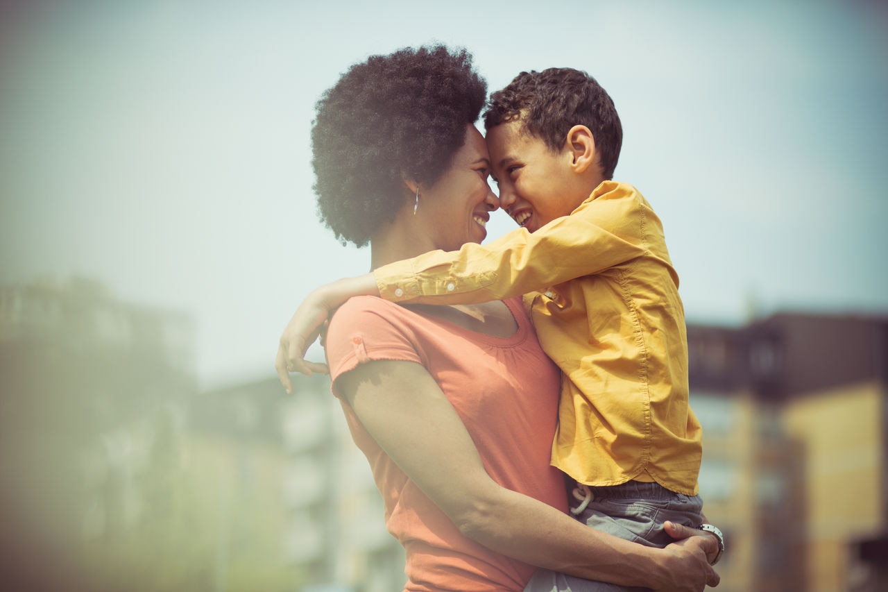 Special connection.  Mother and son in the park.