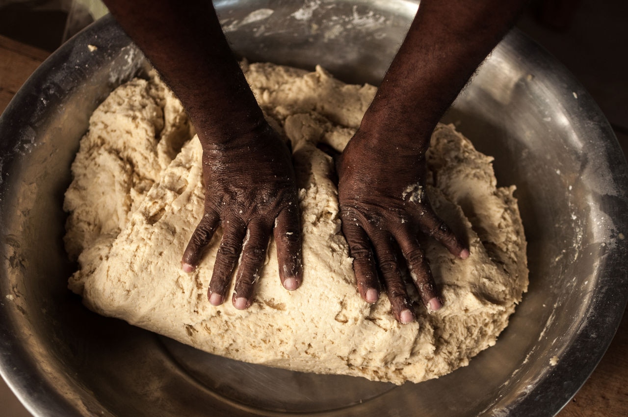 Upside view of hands preparing cookie dough