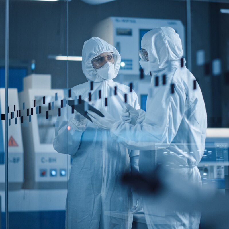 Factory Cleanroom: Engineer and Scientist Wearing Coveralls, Standing in Workshop Talk and Use Tablet Computer, Professionals Develop Technology for Modern CNC Machinery and Electronic Equipment