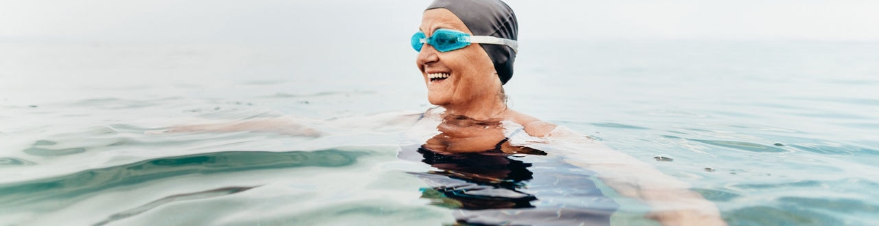 Photo of a senior female swimmer in the sea