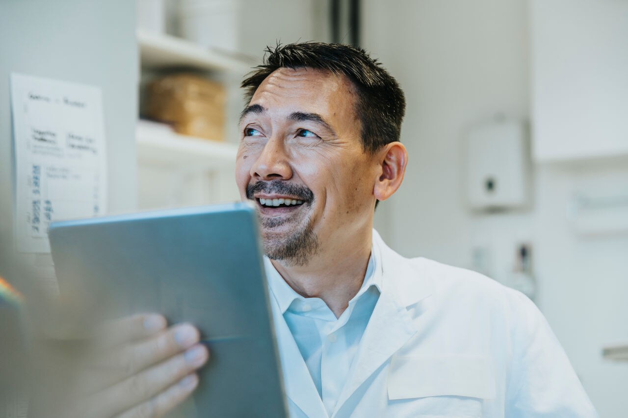 Scientist with a digital tablet in laboratory, NRW, Germany