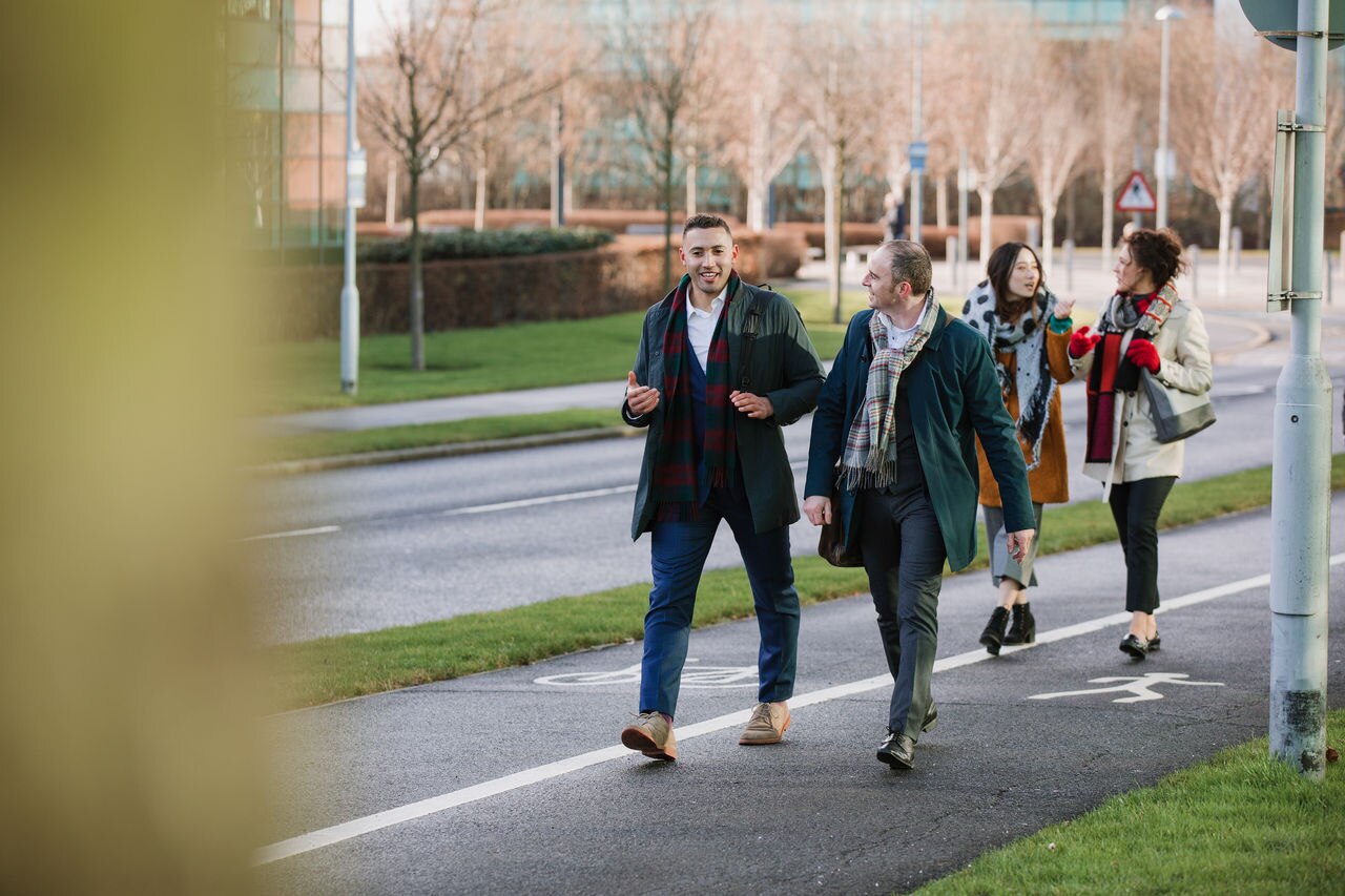 Businesspeople are walking to work in the city.