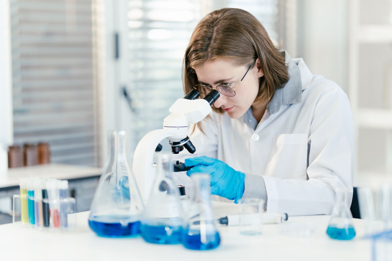 Female Scientist Engrossed in Microscopic Research, Vital Medical Study in Lab, Analyzing Scientific Samples
