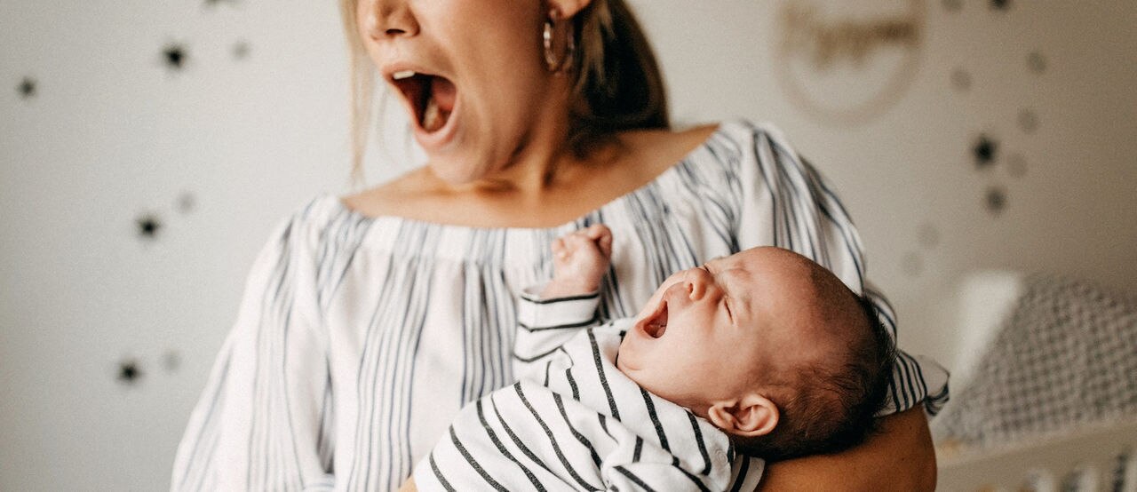 Mother playing with his baby son
