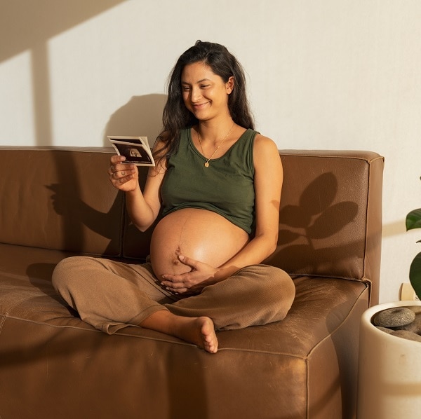 Point of view, Latin woman looking at ultrasound scan at home