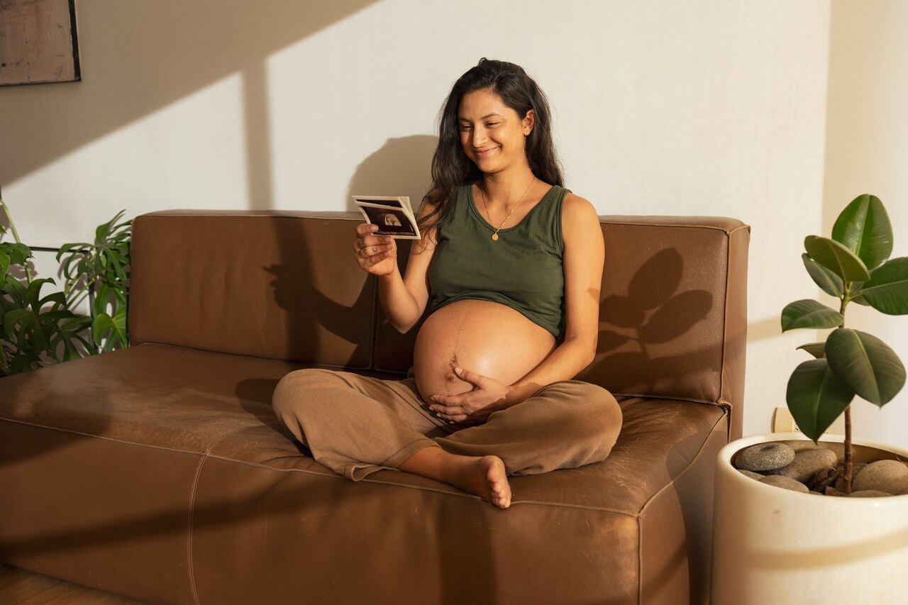 Point of view, Latin woman looking at ultrasound scan at home