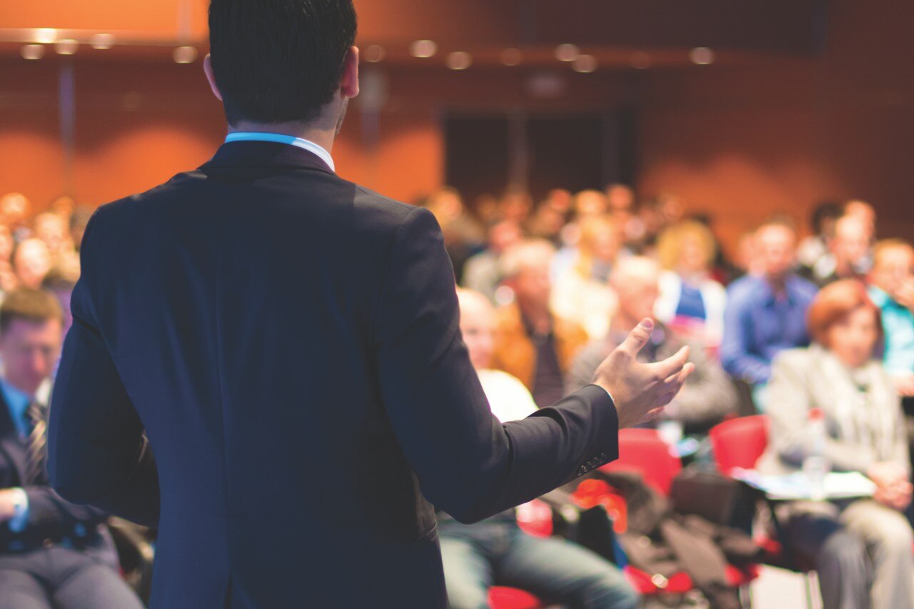 Speaker at Business Conference and Presentation. Audience at the conference hall.